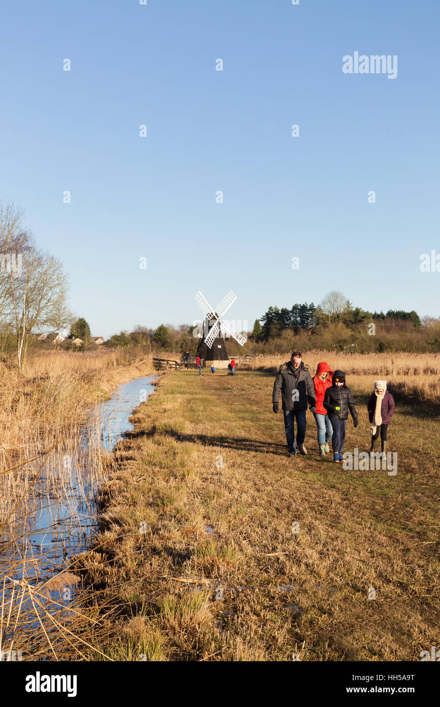 People walking, Wicken Fen in winter, Cambridgeshire countryside, UK Stock Photo