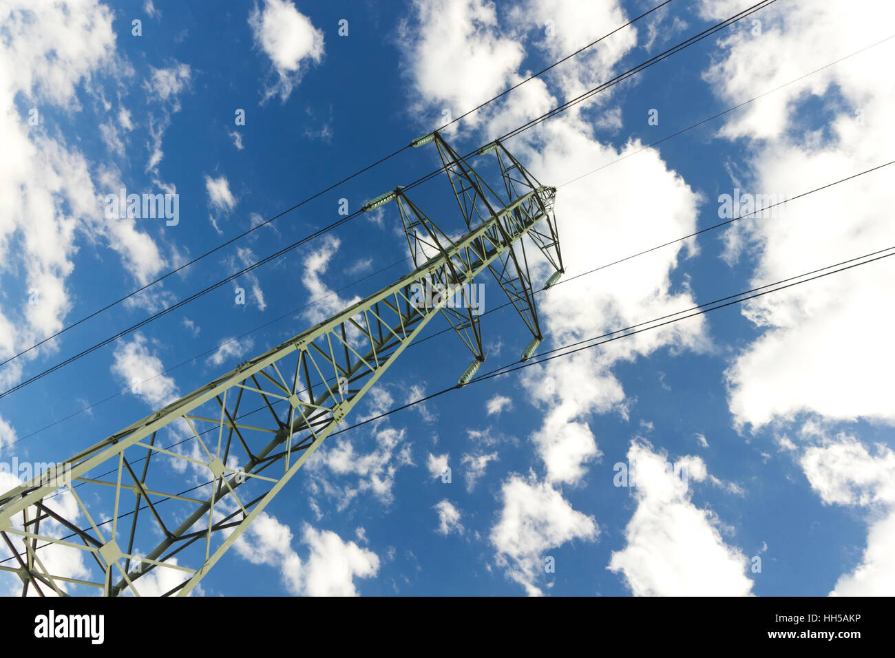 High voltage line on blue sky Stock Photo - Alamy