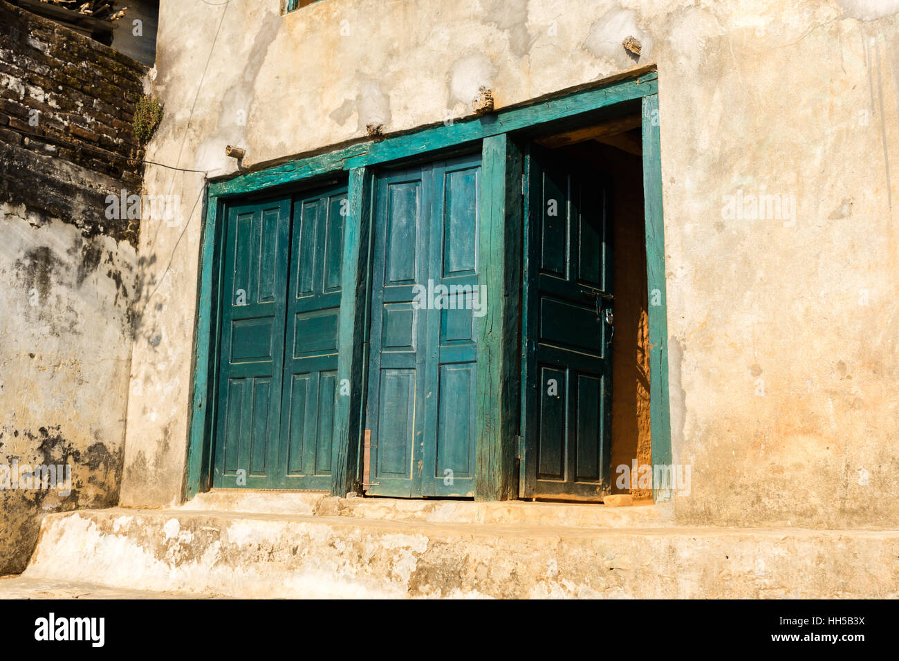 Ancient wooden door in old stone wall Stock Photo - Alamy