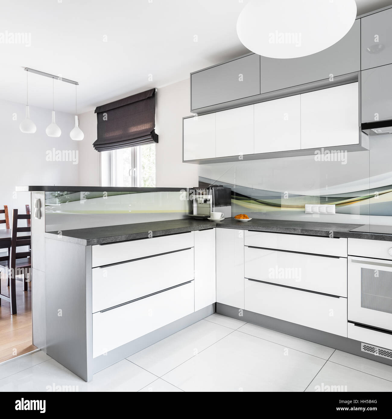 New white kitchen and dining room with window Stock Photo - Alamy