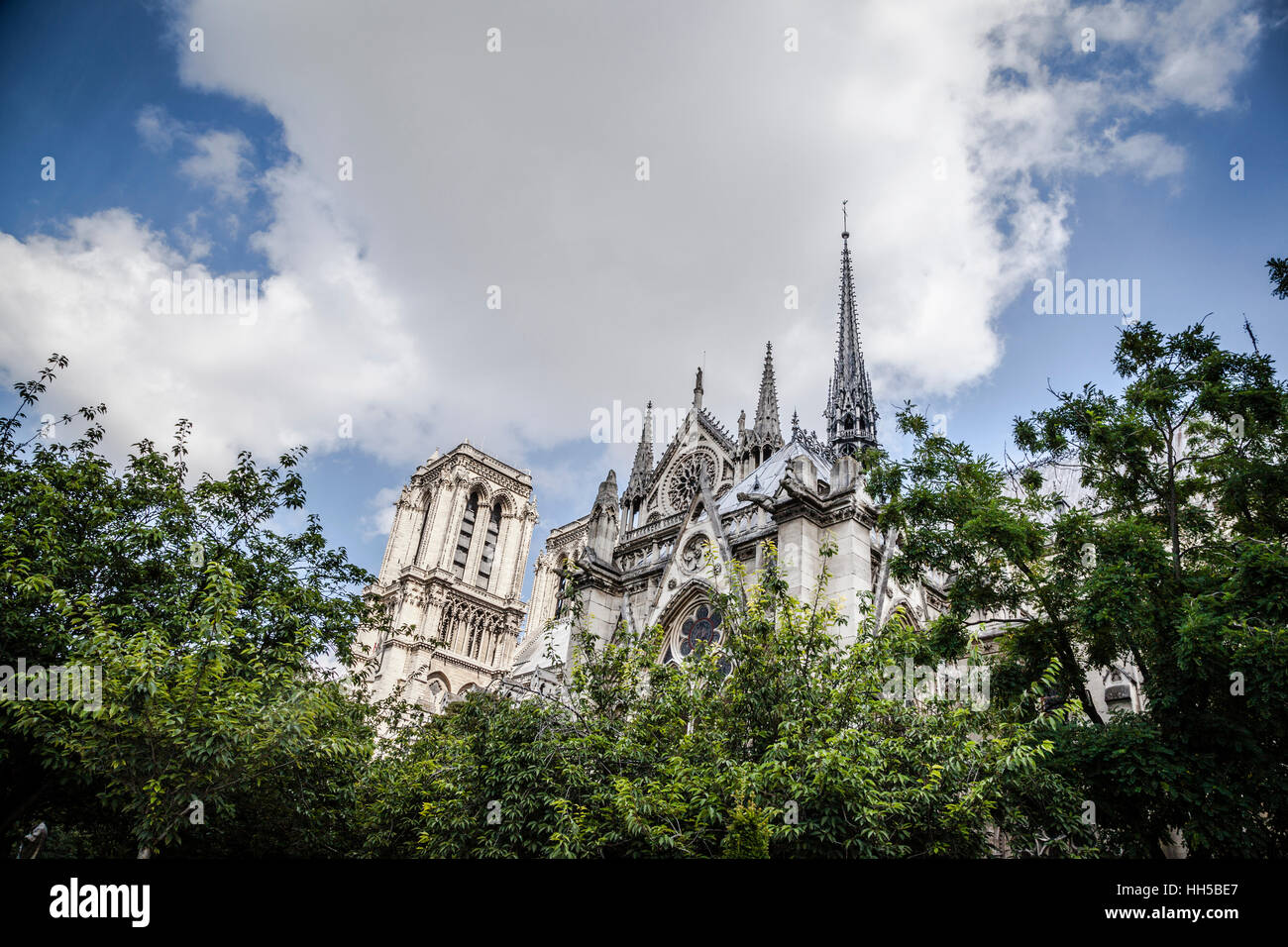 Notre Dame cathedral with puffy clouds, Paris, France Stock Photo