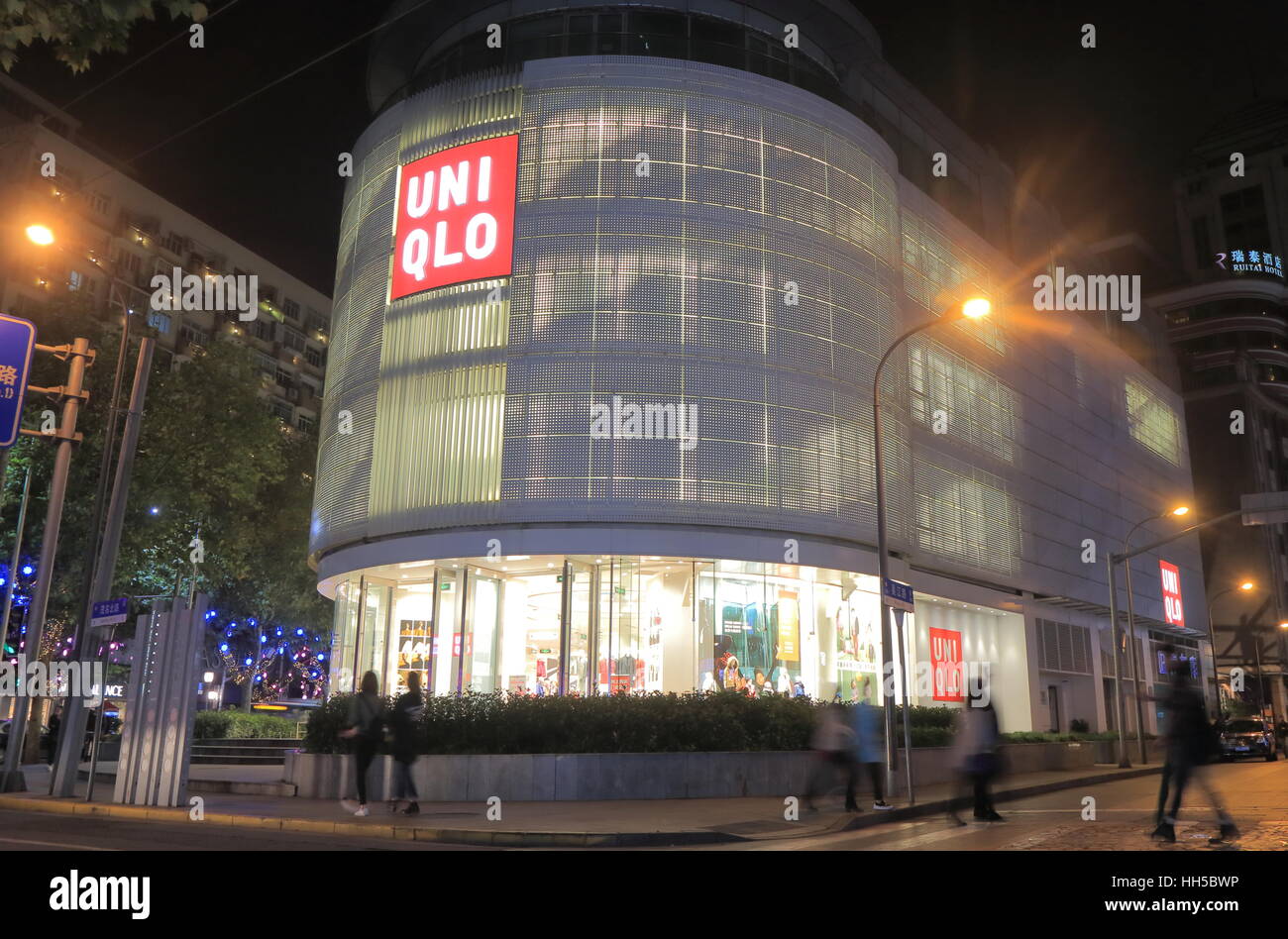 People visit UNIQLO store on Nanjing road west in Shanghai China. UNIQLO is  a Japanese casual wear designer, manufacture and retailer operating worldw  Stock Photo - Alamy