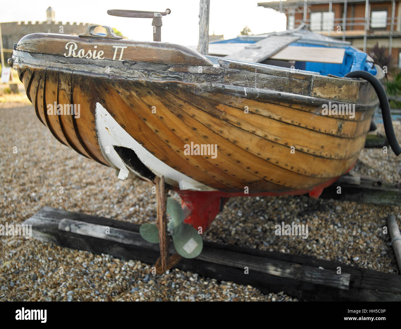 Clinker Fishing Boat hauled up on the shingle, Deal Beach, Kent UK Stock Photo