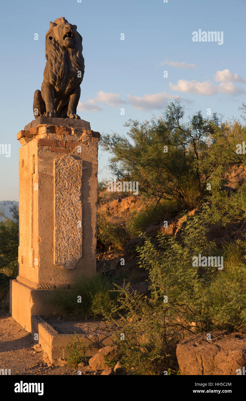 Cast iron lion statue guarding Grotto Hill entrance to religious shrine, above Mission San Xavier del Bac, installed in 1908 Stock Photo