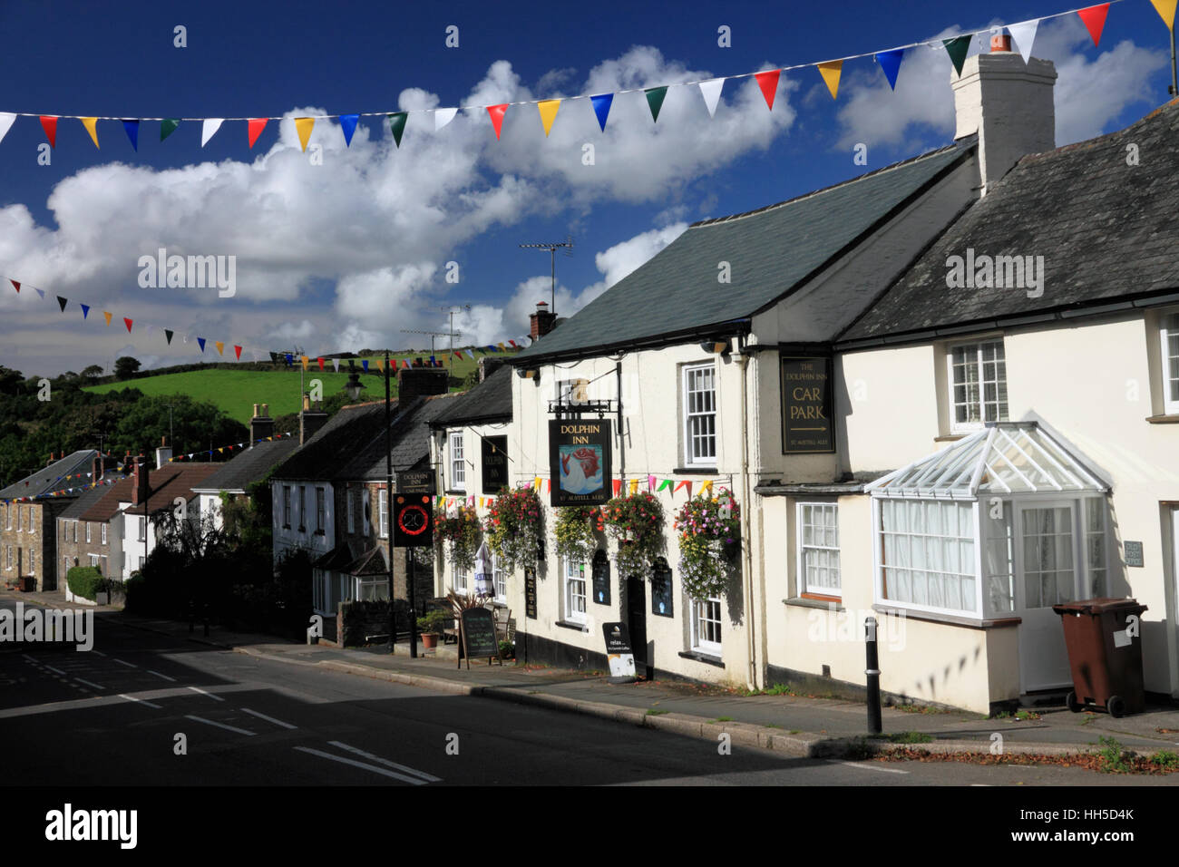 A village street with cottages and bunting. Stock Photo