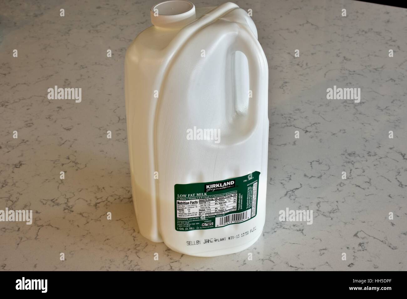 https://c8.alamy.com/comp/HH5DPF/a-kirkland-brand-gallon-of-milk-on-a-white-marble-surface-HH5DPF.jpg