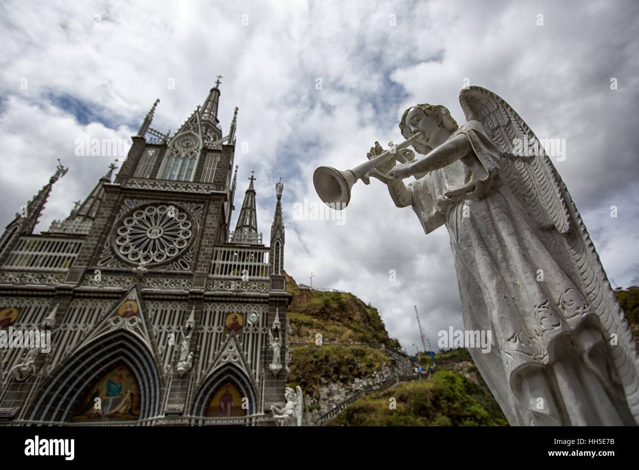 religious statue in front of Las Lajas cathedral in Colombia Stock Photo