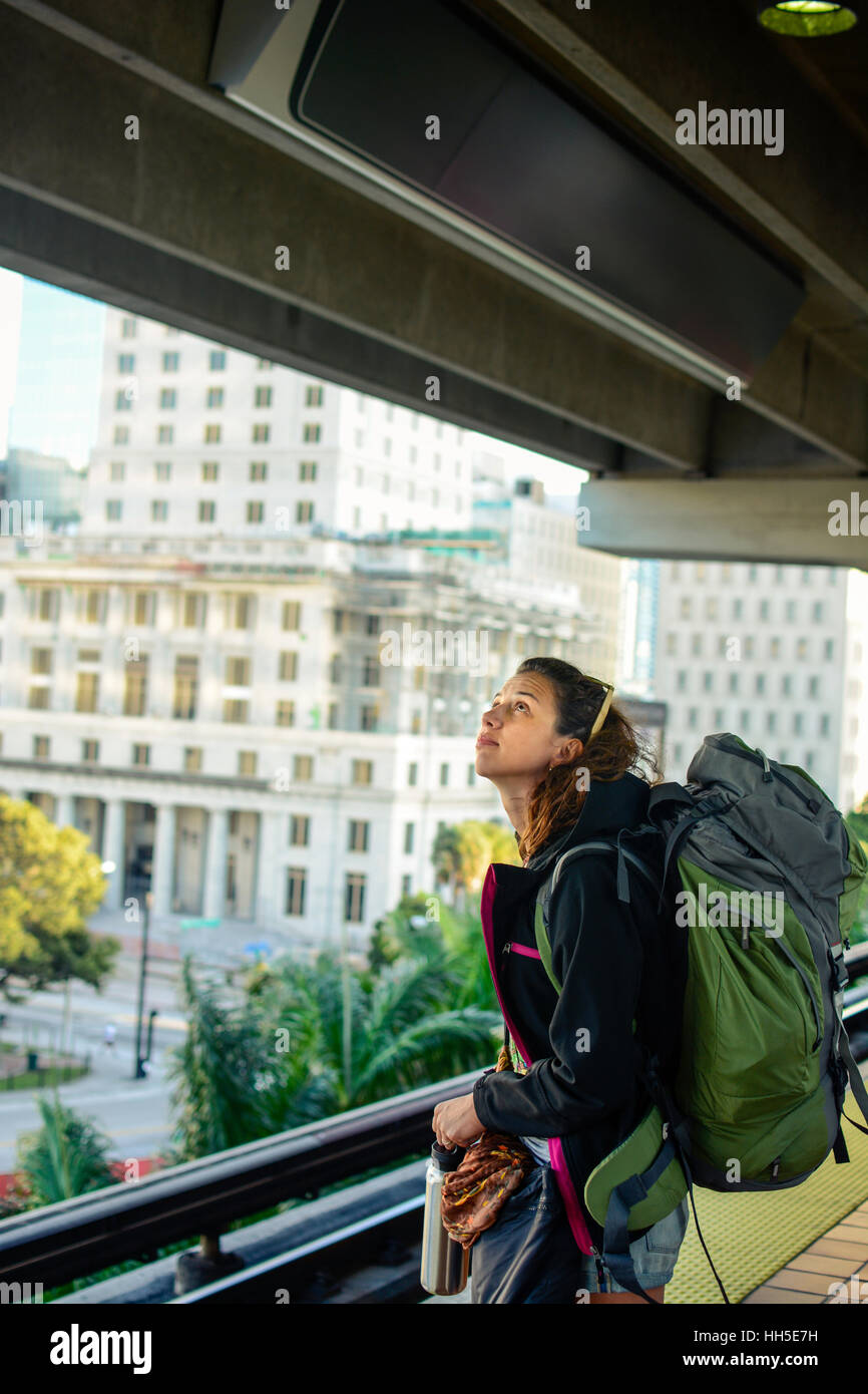 Backpacker girl in Miami subway Stock Photo