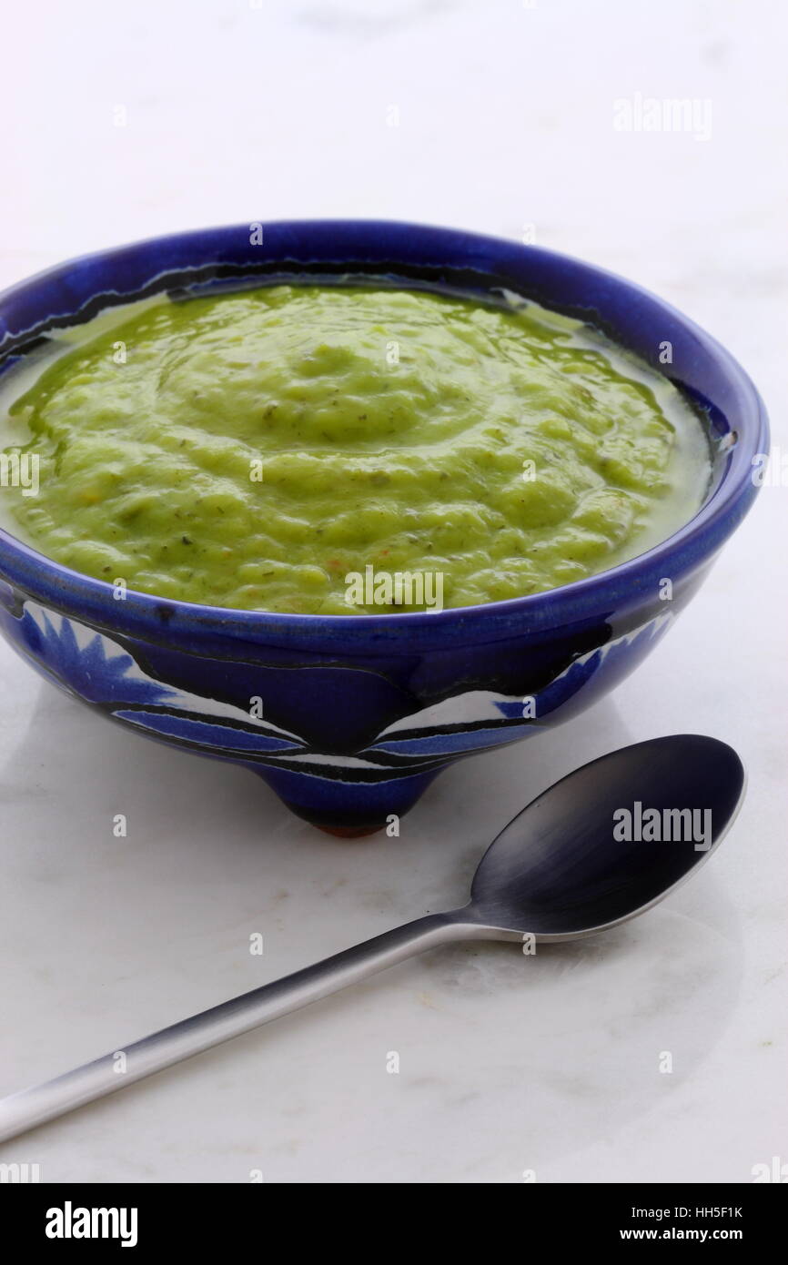 Mexican guacamole, prepared with fresh avocados, lemon juice, vinegar