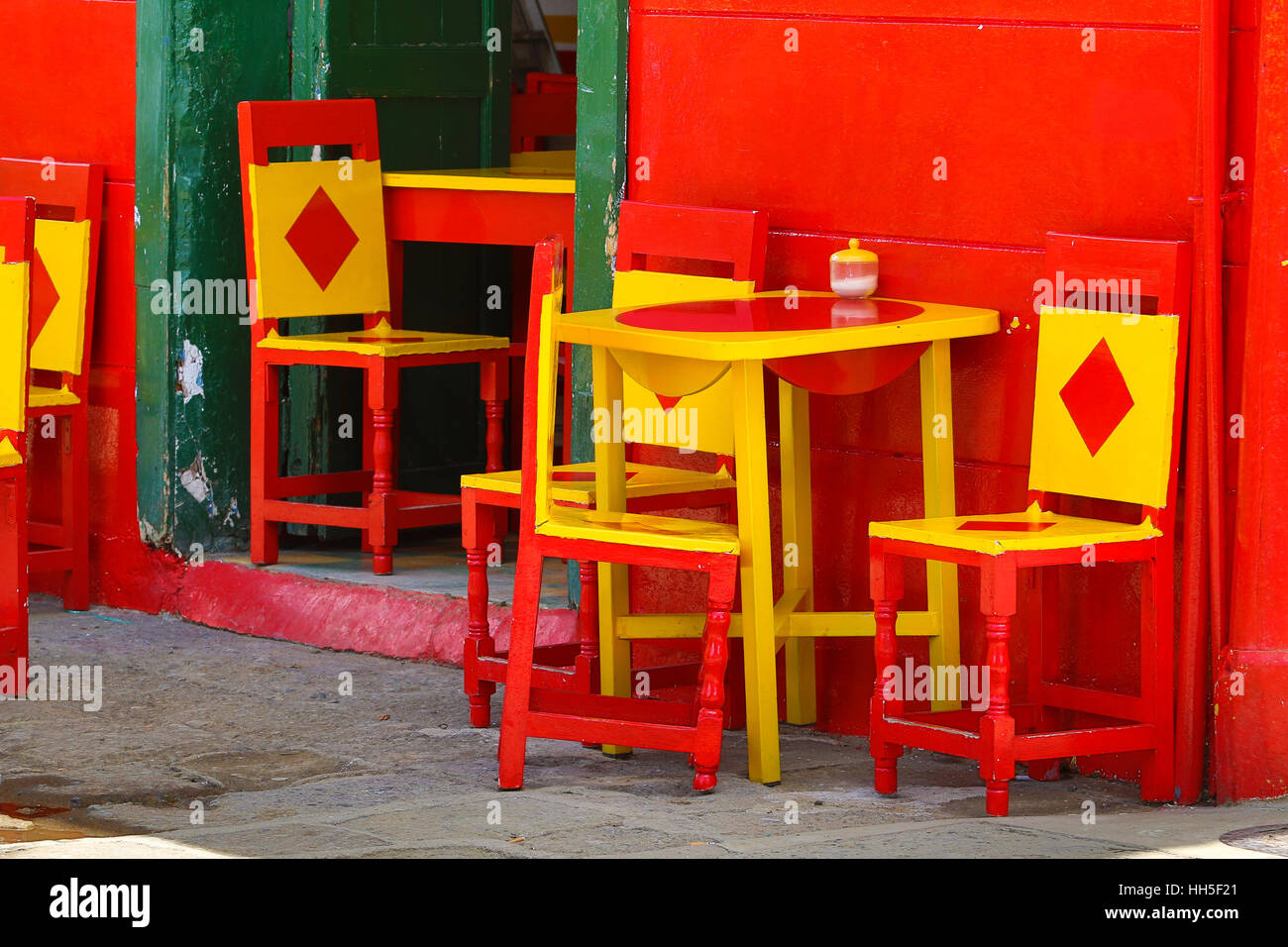 colourful chairs in front of a building in El Jardin Antioquia Stock Photo