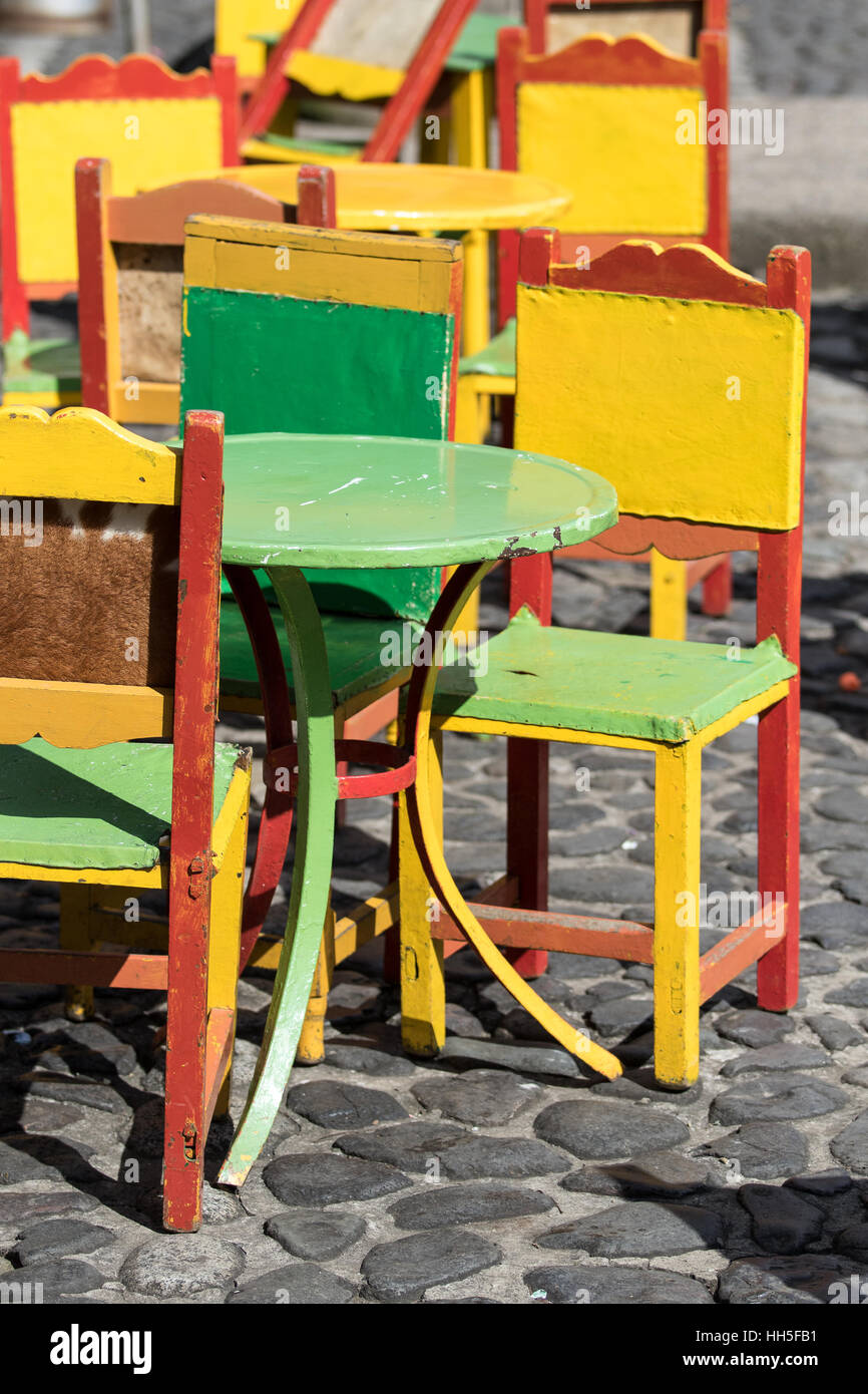 Café patio furniture brightly painted El Jardin Stock Photo