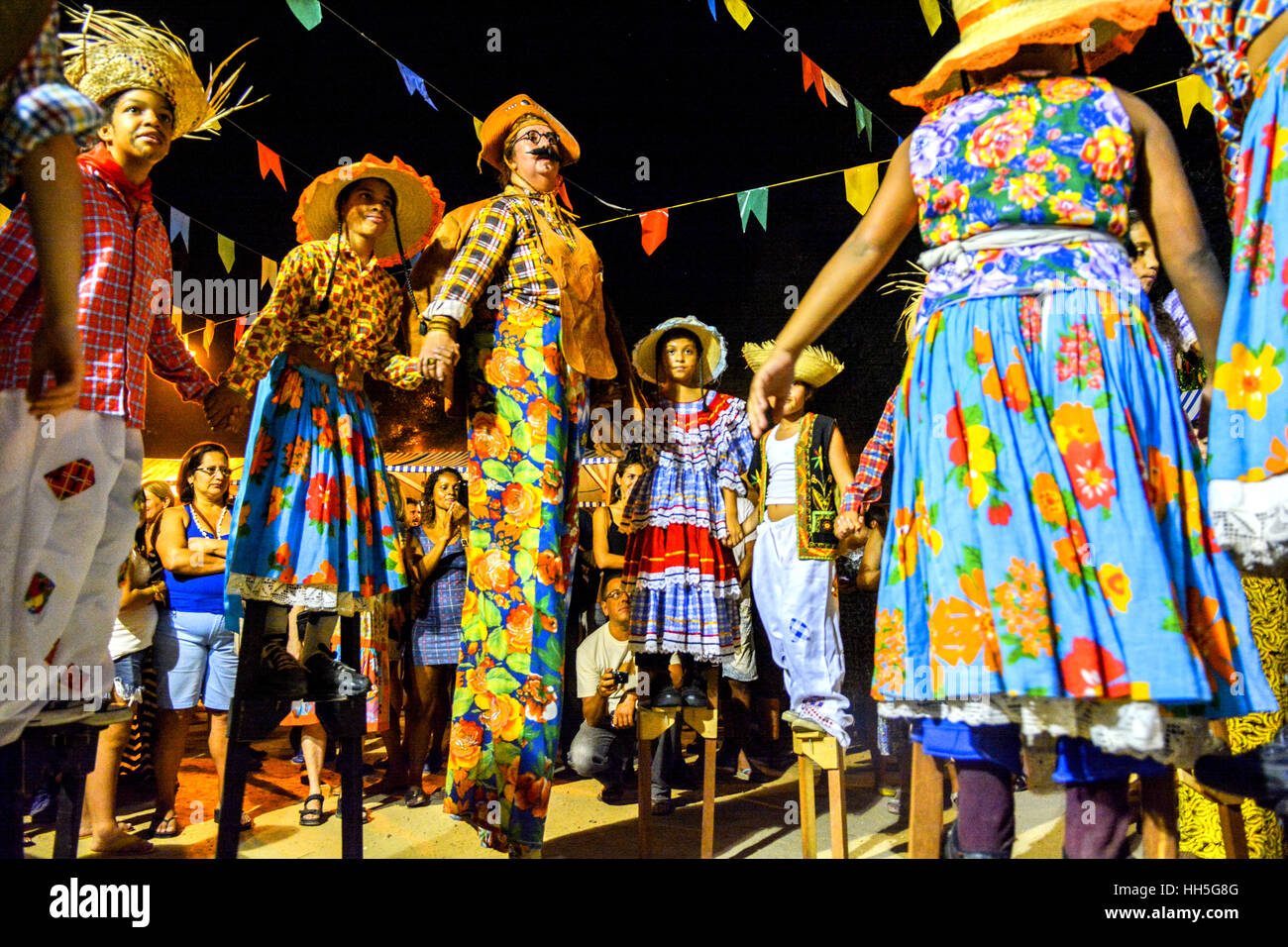 People in country costumes perform Festa Junina, or in English 'June Holiday/Party' Brazil's month long celebration of the harvest and rural life. Stock Photo