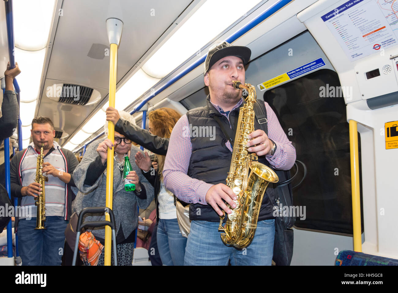Buskers playing music in London Underground carriage, West End, City of Westminster, Greater London, England, United Kingdom Stock Photo
