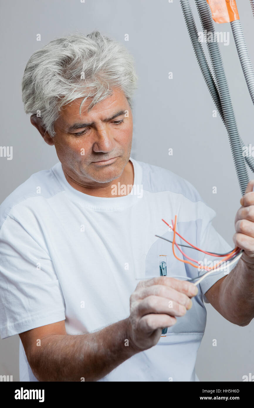 Electrician working on his own Stock Photo Alamy