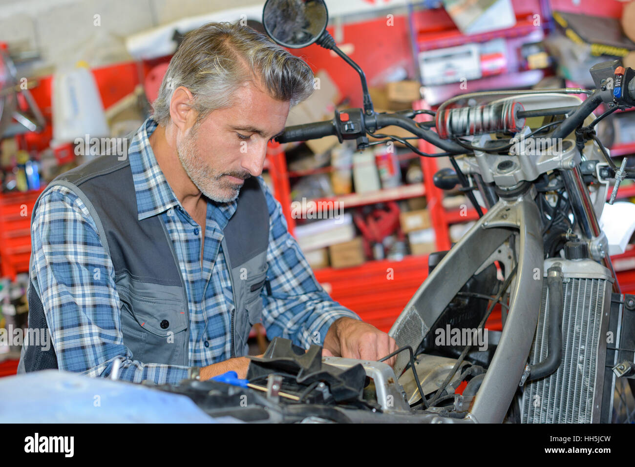 fixing a motorcycle Stock Photo Alamy