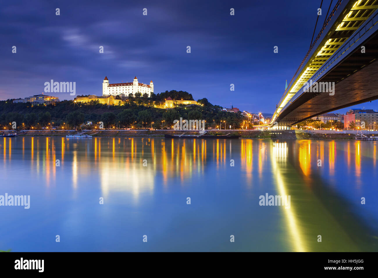 Bratislava castle,Parliament and the New bridge over Danube river with evening lights in capital city of Slovakia,Bratislava Stock Photo