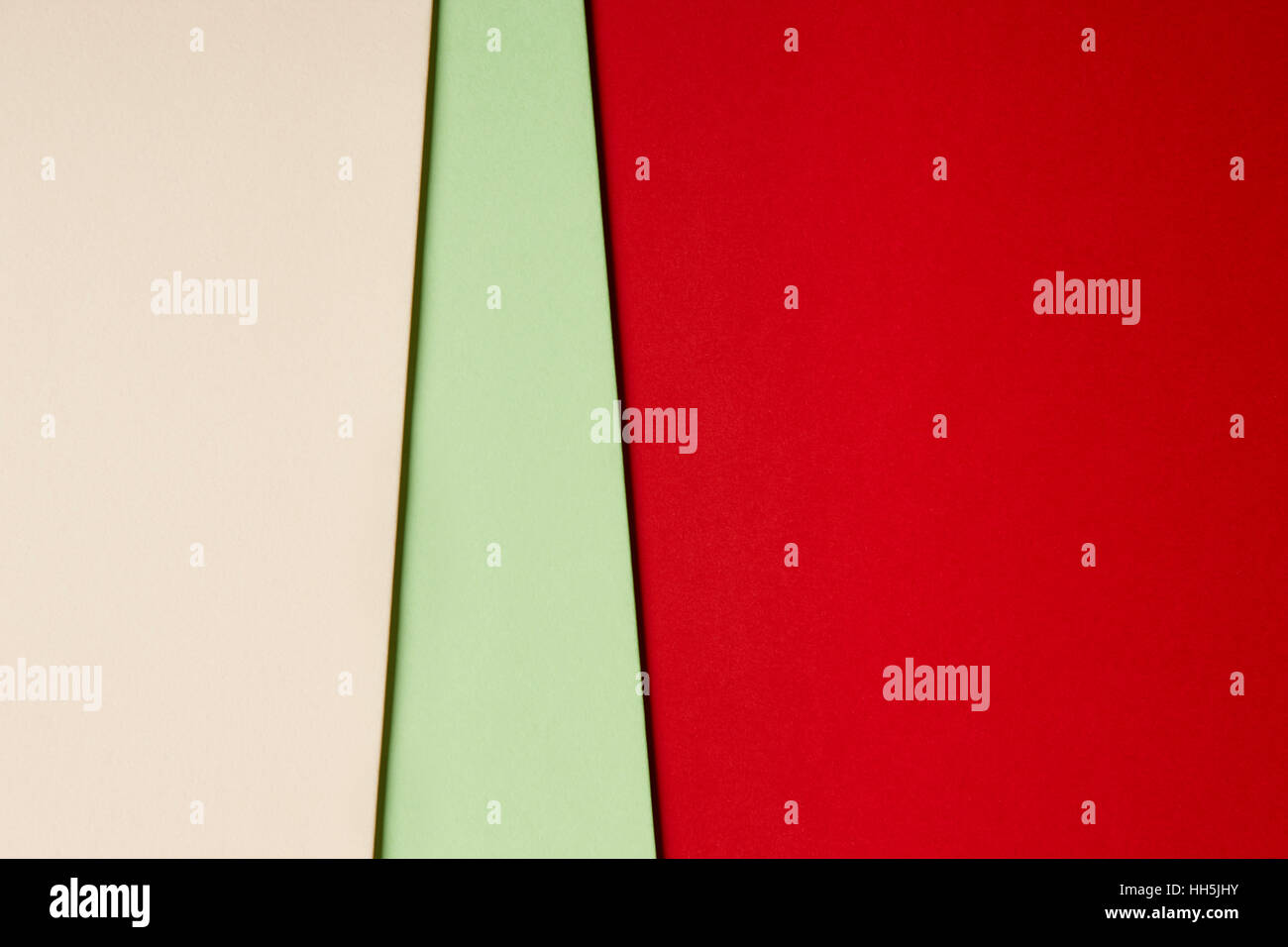 Colored cardboards background beige green red tone. Copy space