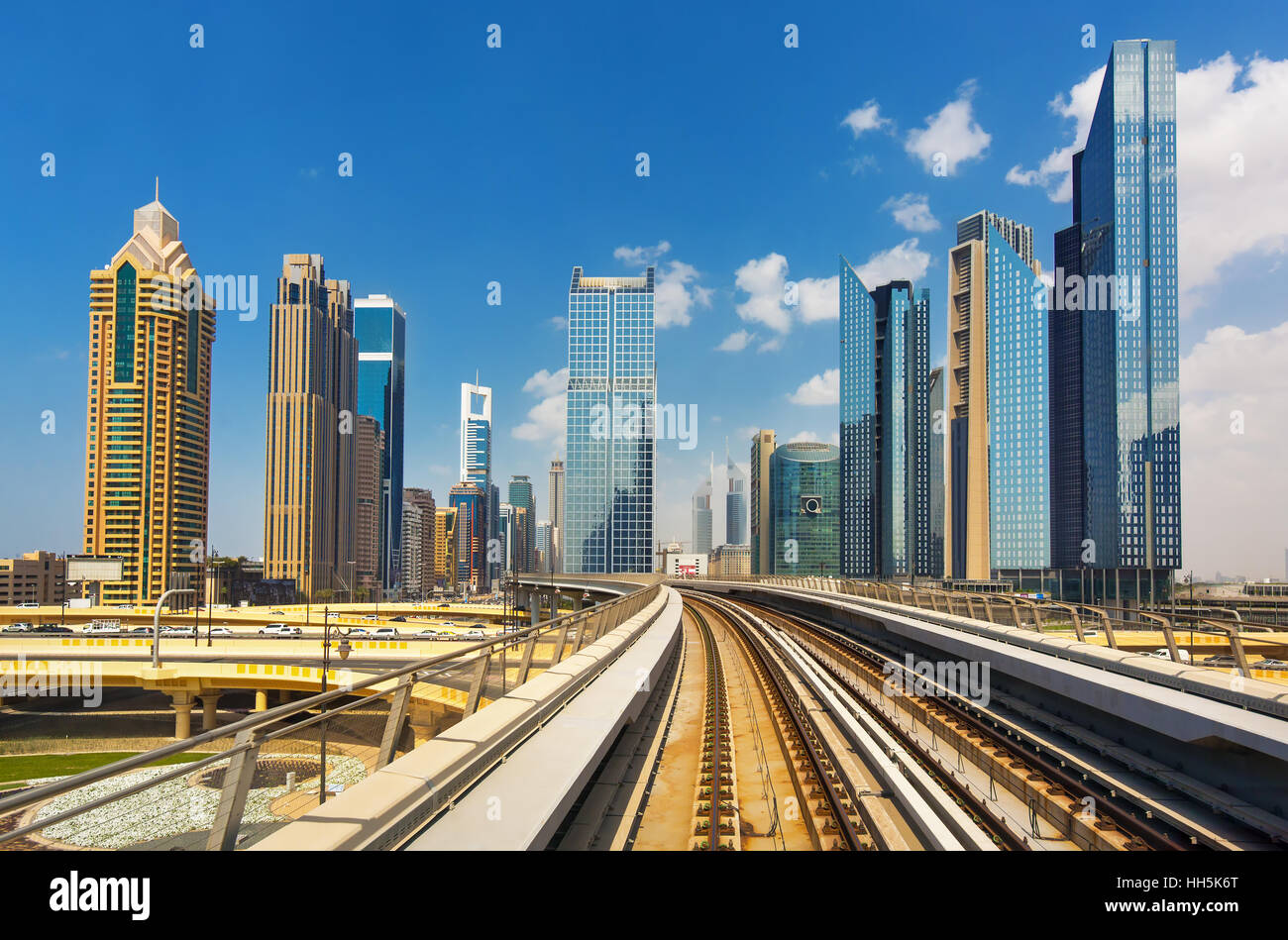 Modern skyscrapers and the Dubai Metro - driverless, fully automated metro rail network,Dubai,United Arab Emirates Stock Photo