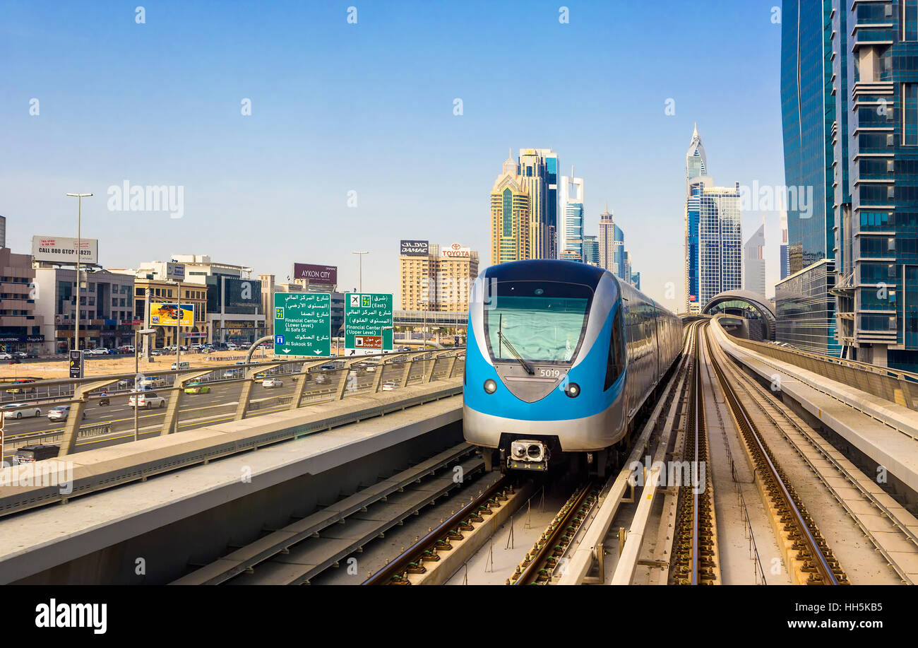 DUBAI,UNITED ARAB EMIRATES-MARCH 5, 2016: Metro railway and luxury Dubai city,United Arab Emirates Stock Photo