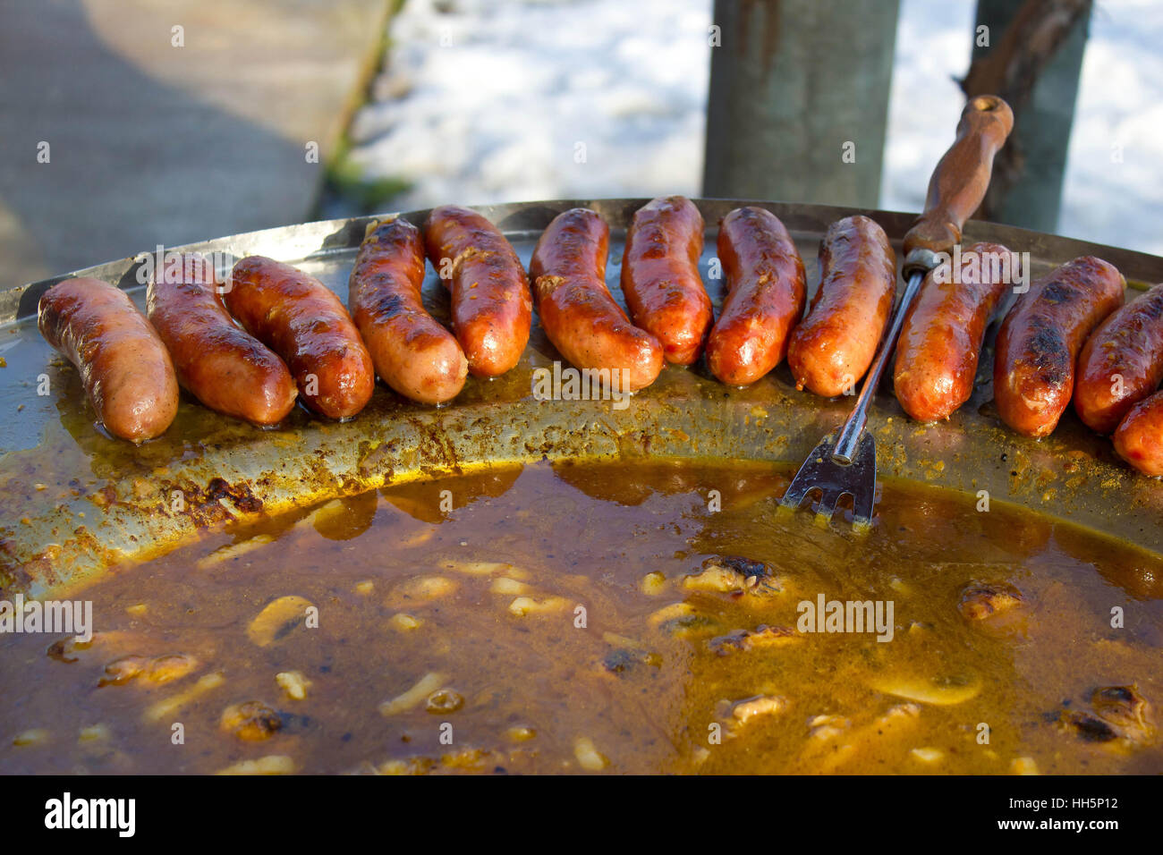 Baked sausages in traditional croatian dish kotlovina Stock Photo