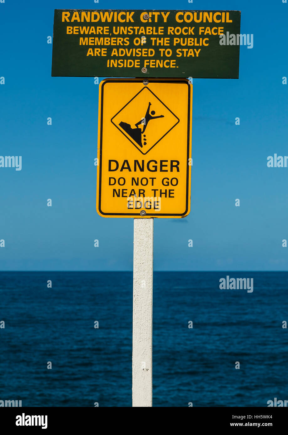 Danger sign - do not go near the edge of the cliff Stock Photo