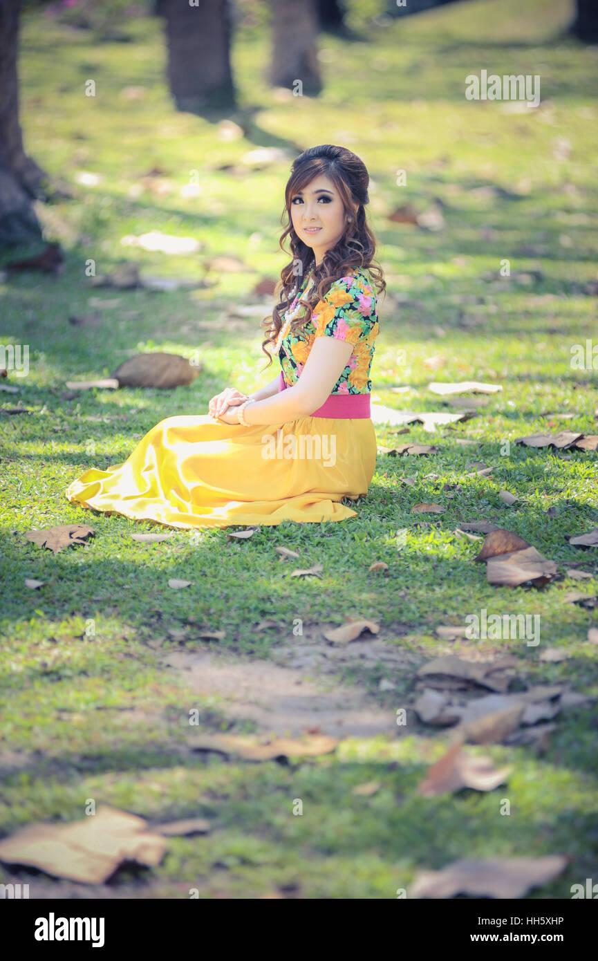 asia beautiful girl in the yellow dress on nature Stock Photo - Alamy