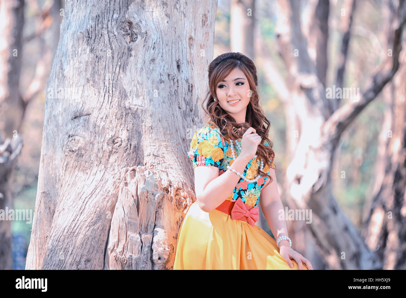 asia beautiful girl in the yellow dress on nature Stock Photo - Alamy