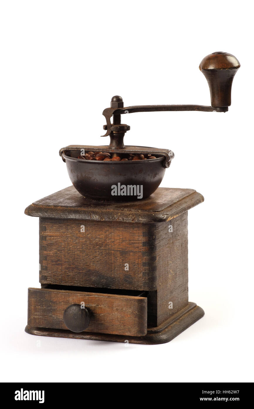 Photo of an antique coffee grinder isolated on a white background Stock