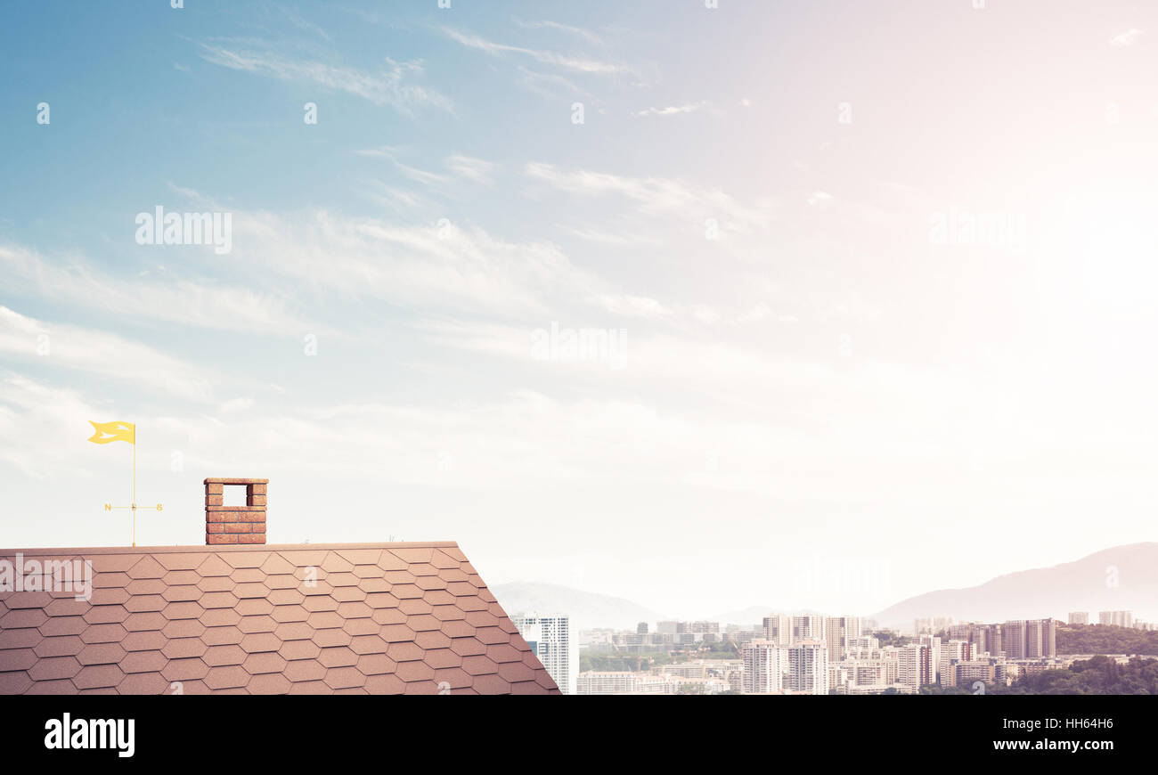 Brick house roof and modern cityscape at background Stock Photo - Alamy