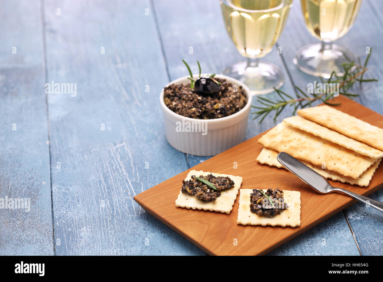 black olive tapenade with crackers Stock Photo Alamy