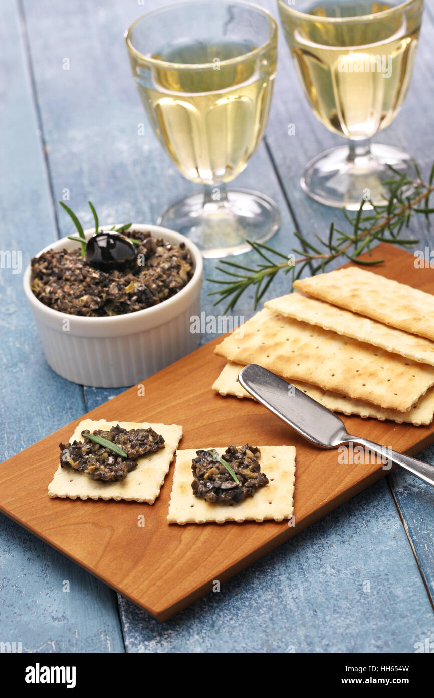 black olive tapenade with crackers Stock Photo Alamy