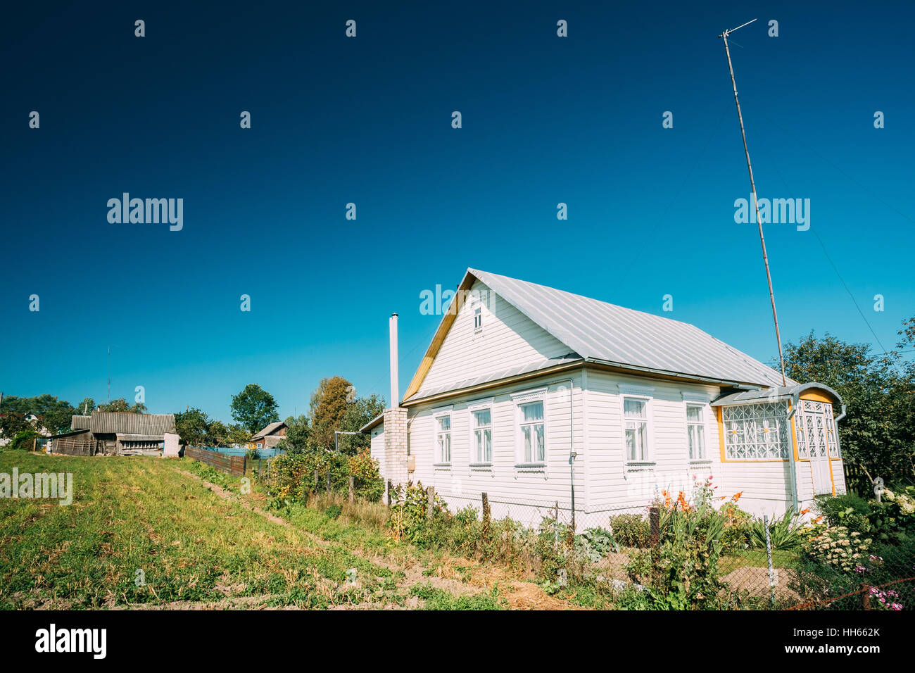 Russian Traditional Wooden House In Village Or Countryside Of Belarus