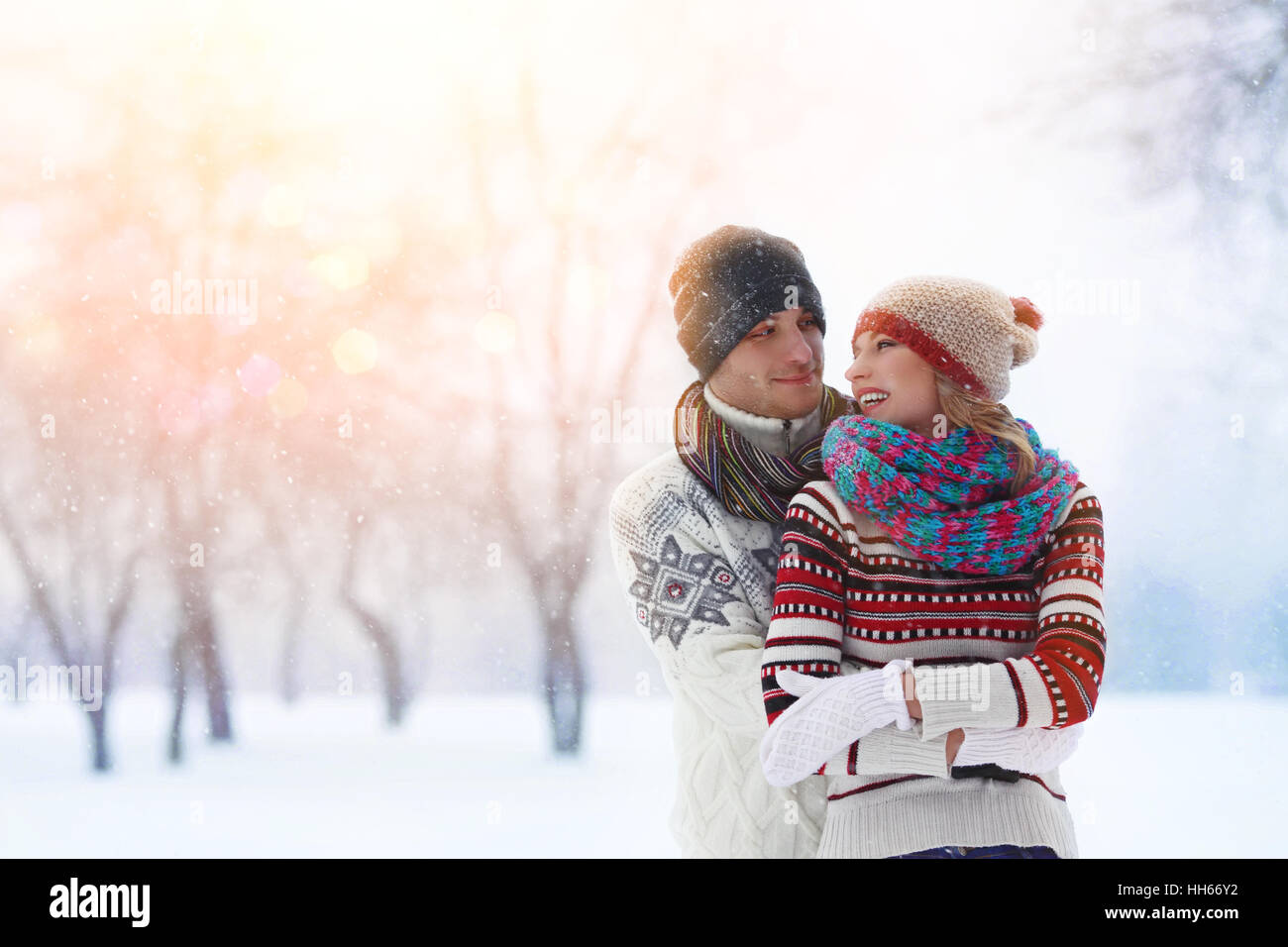 Winter couple. Happy Couple Having Fun Outdoors. Snow. Winter Vacation. Outdoor . Stock Photo