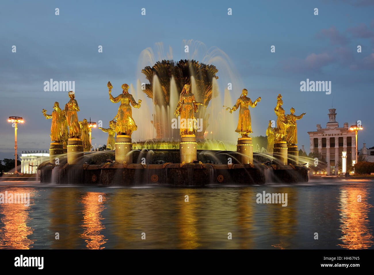 Illuminated Fountain of Friendship of People at Twilight. VDNKh exhibition in  Moscow, Russia Stock Photo