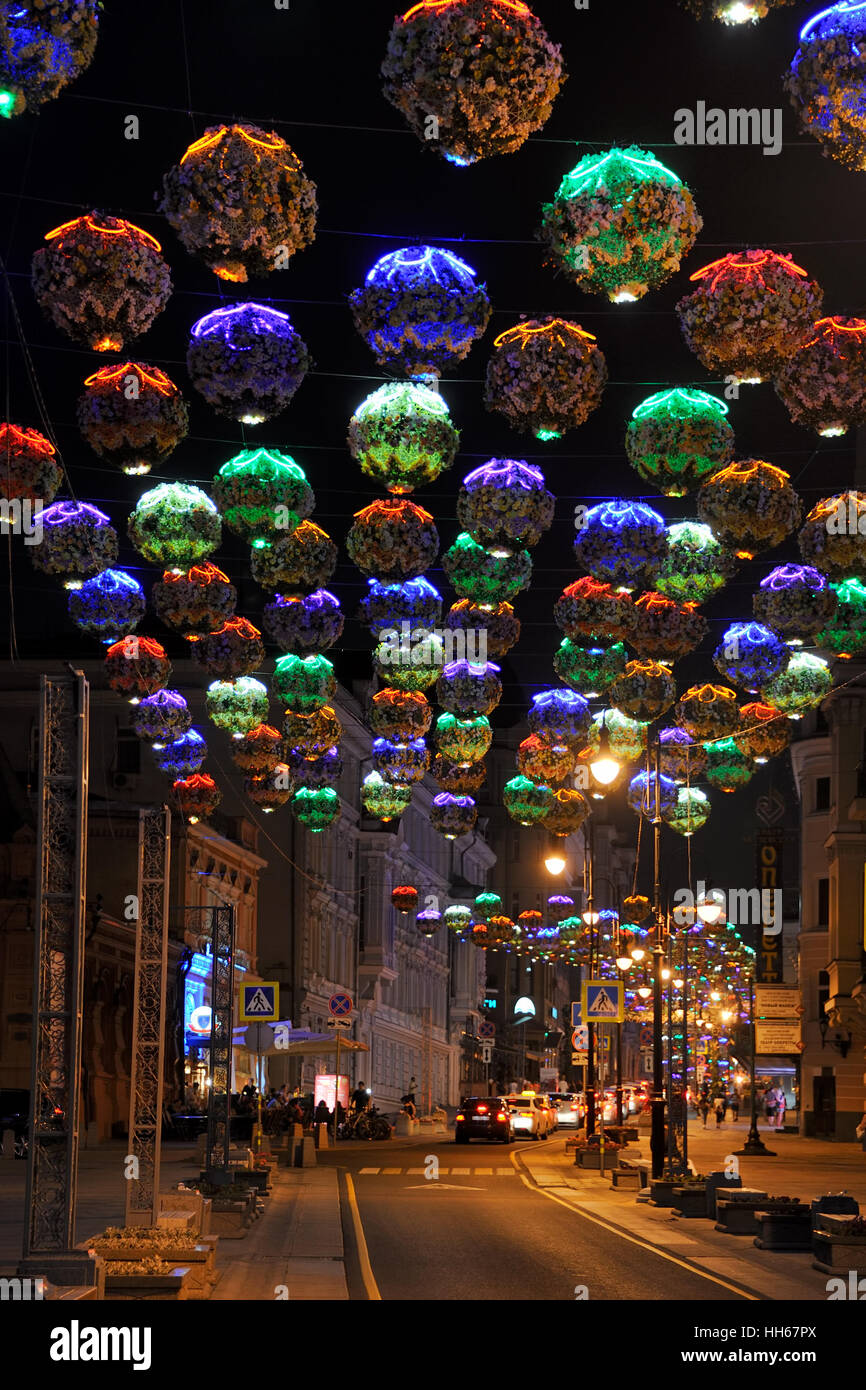 Colorful Flower Lights on Bolshaya Dmitrovka. Beautiful decorations of Moscow street at night. Russia Stock Photo