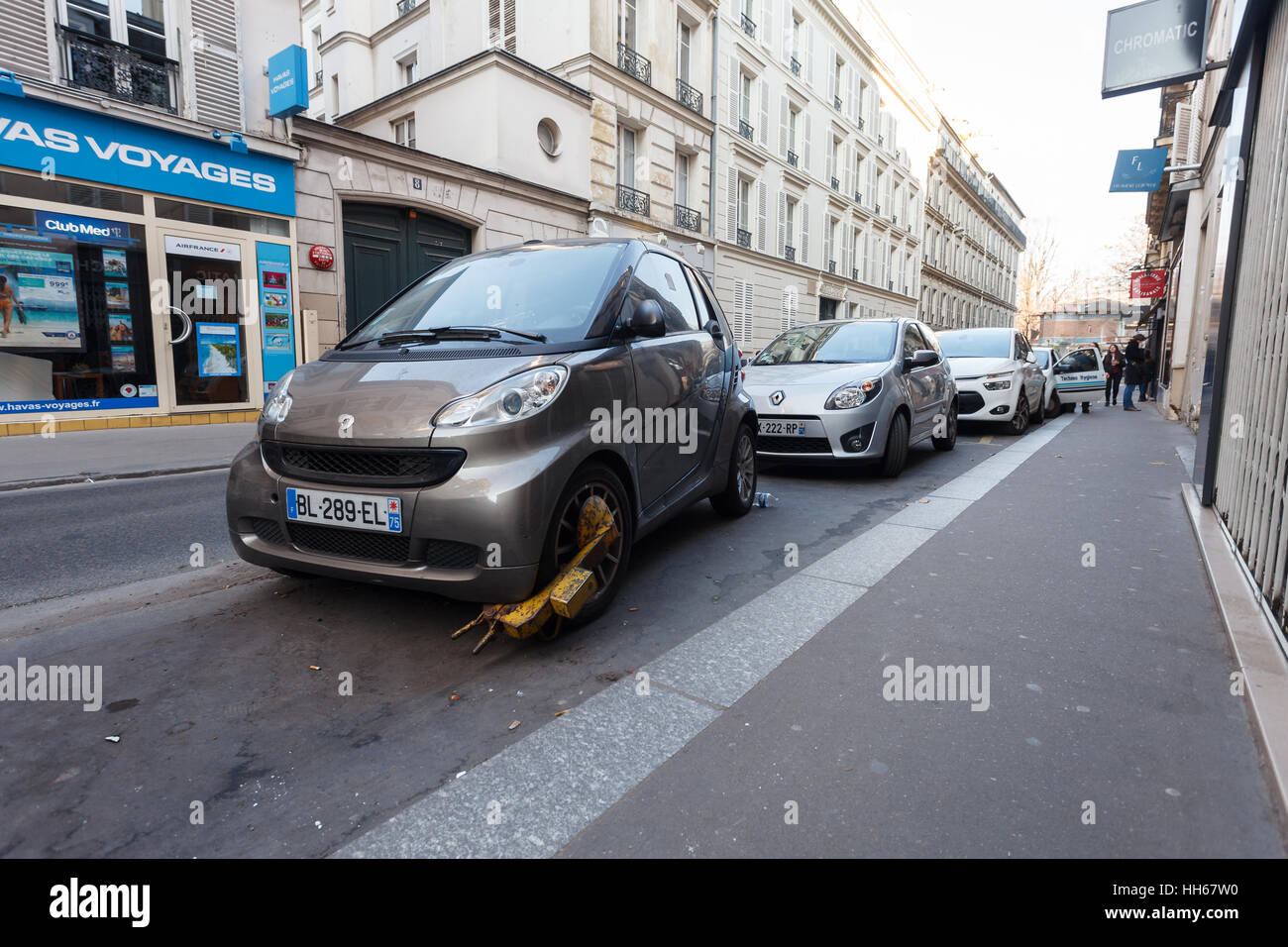 Penalty for improper parking of car - wheel lock on Smart car Stock Photo