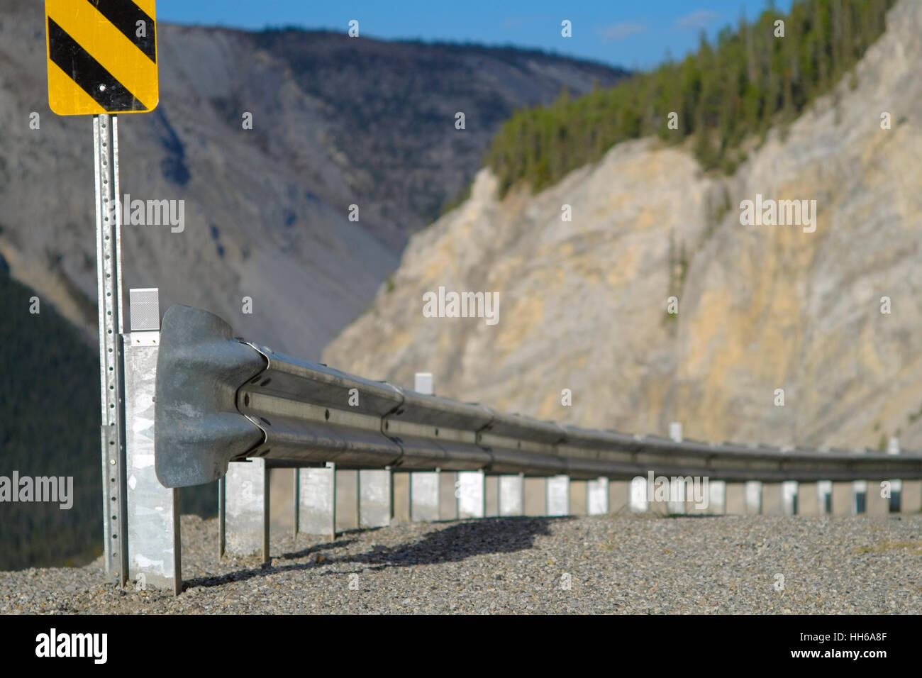 Highway fenders and guard rails improves trafic saftey. In North America we use guardrails or guard rails. Guard rails do improve passenger safety. Stock Photo
