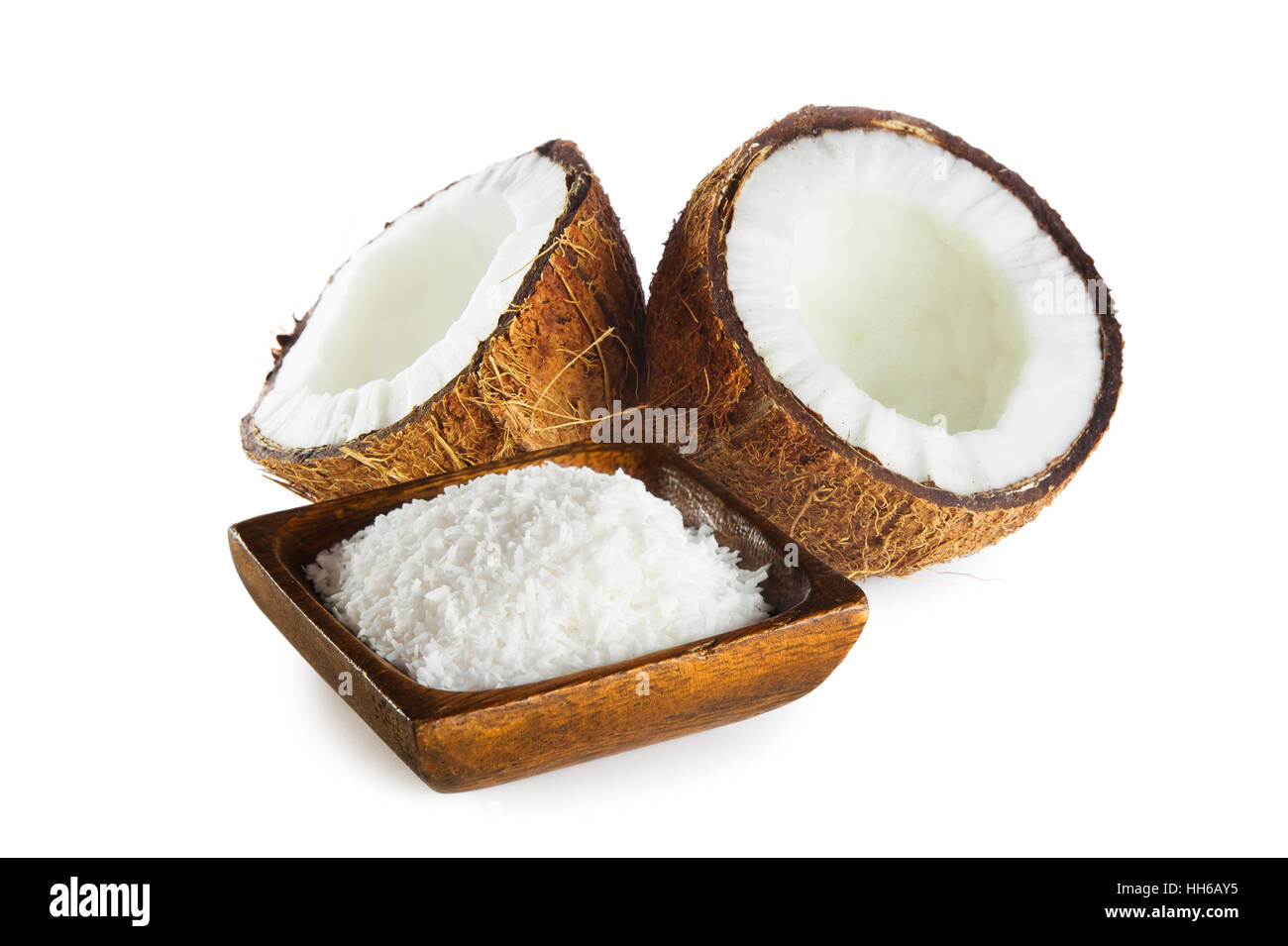 Shredded coconut in wooden bowl isolated on white background Stock Photo