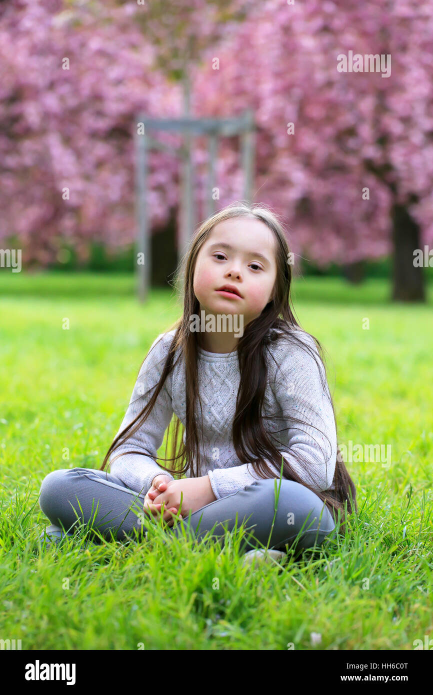Beautiful girl in blossom park Stock Photo - Alamy