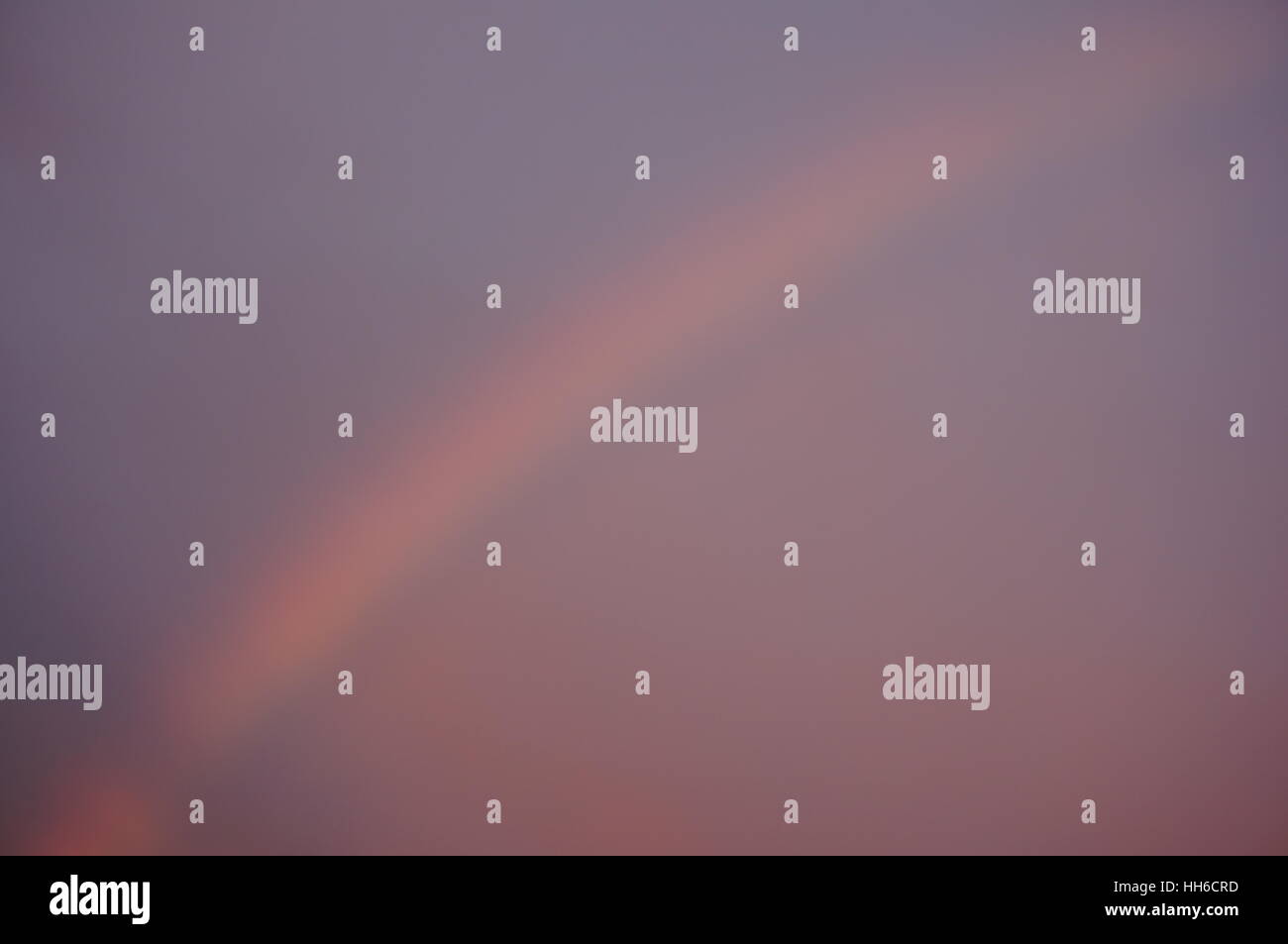 Rainbow in dark sky hi-res stock photography and images - Alamy