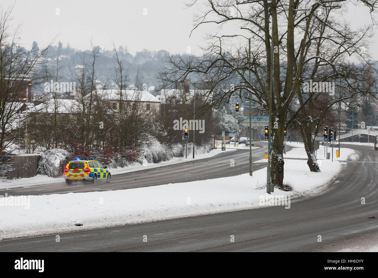 SURREY, UK A police car responds to an emergency call in the snow. Stock Photo