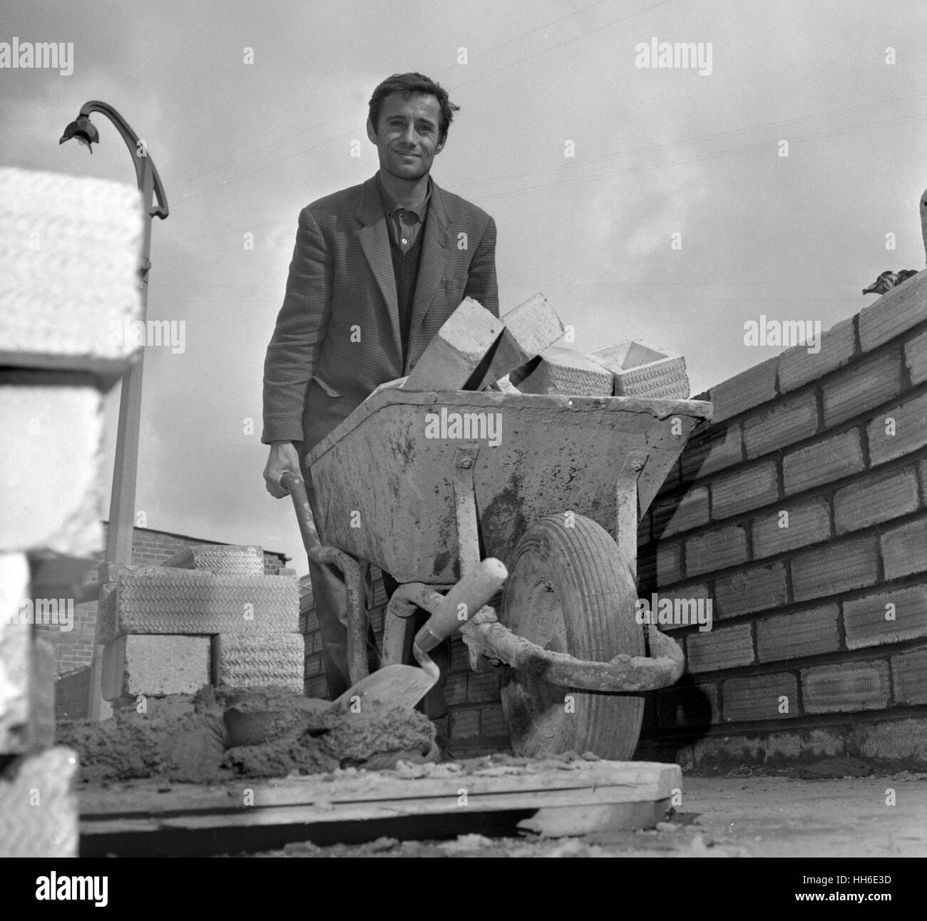 Surrounded by the tools of his trade is 30-year-old bricklayer Norman Jackson, who is to join as a student the university he helped to build. Norman, who lives in Hull, East Yorkshire, worked on the new science block extensions at University of Hull and now he has heard he has been successful in gaining a Ministry of Education Grant Scholarship to Hull. He will take a three-year English Literature course. Stock Photo