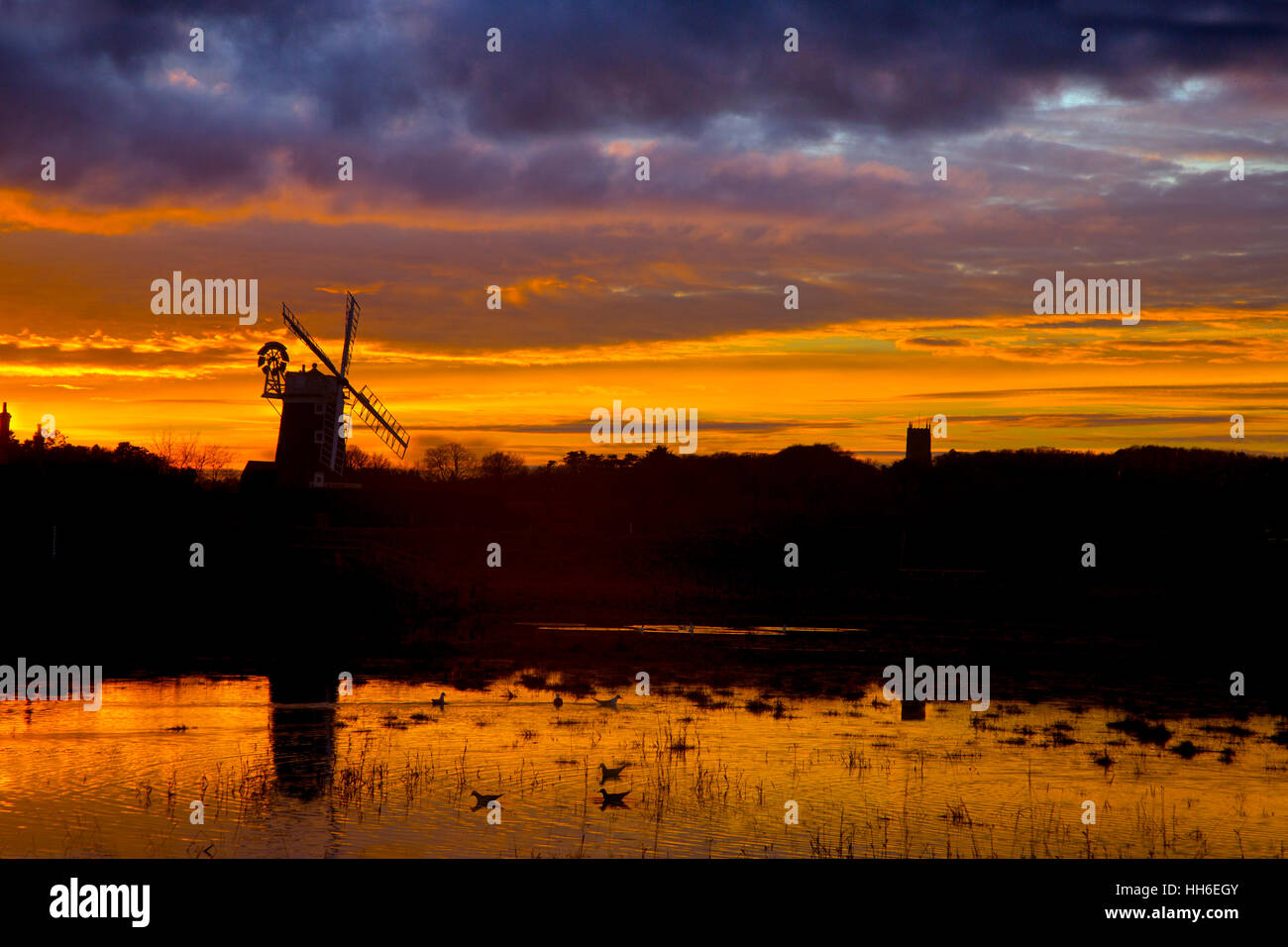 Cley windmill and Cley Marshes Nature Reserve on the North Norfolk coast Stock Photo