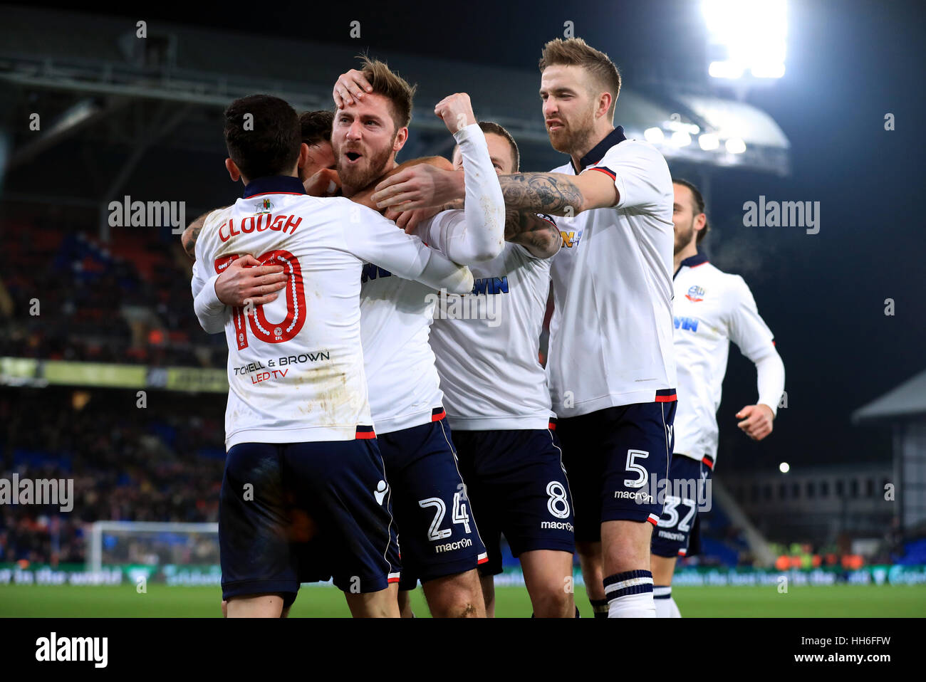 Bolton Wanderers' James Henry (no.24) celebrates scoring his side's first goal of the game with team-mates during the Emirates FA Cup, third round replay match at Selhurst Park, London. Stock Photo