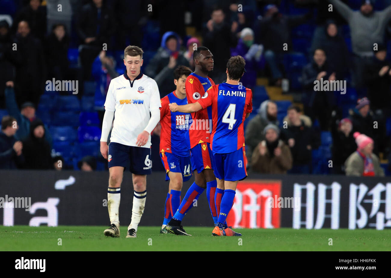 Crystal Palace's Christian Benteke celebrates scoring his side's second goal of the game as Bolton Wanderers' Josh Vela stands dejected during the Emirates FA Cup, third round replay match at Selhurst Park, London. Stock Photo