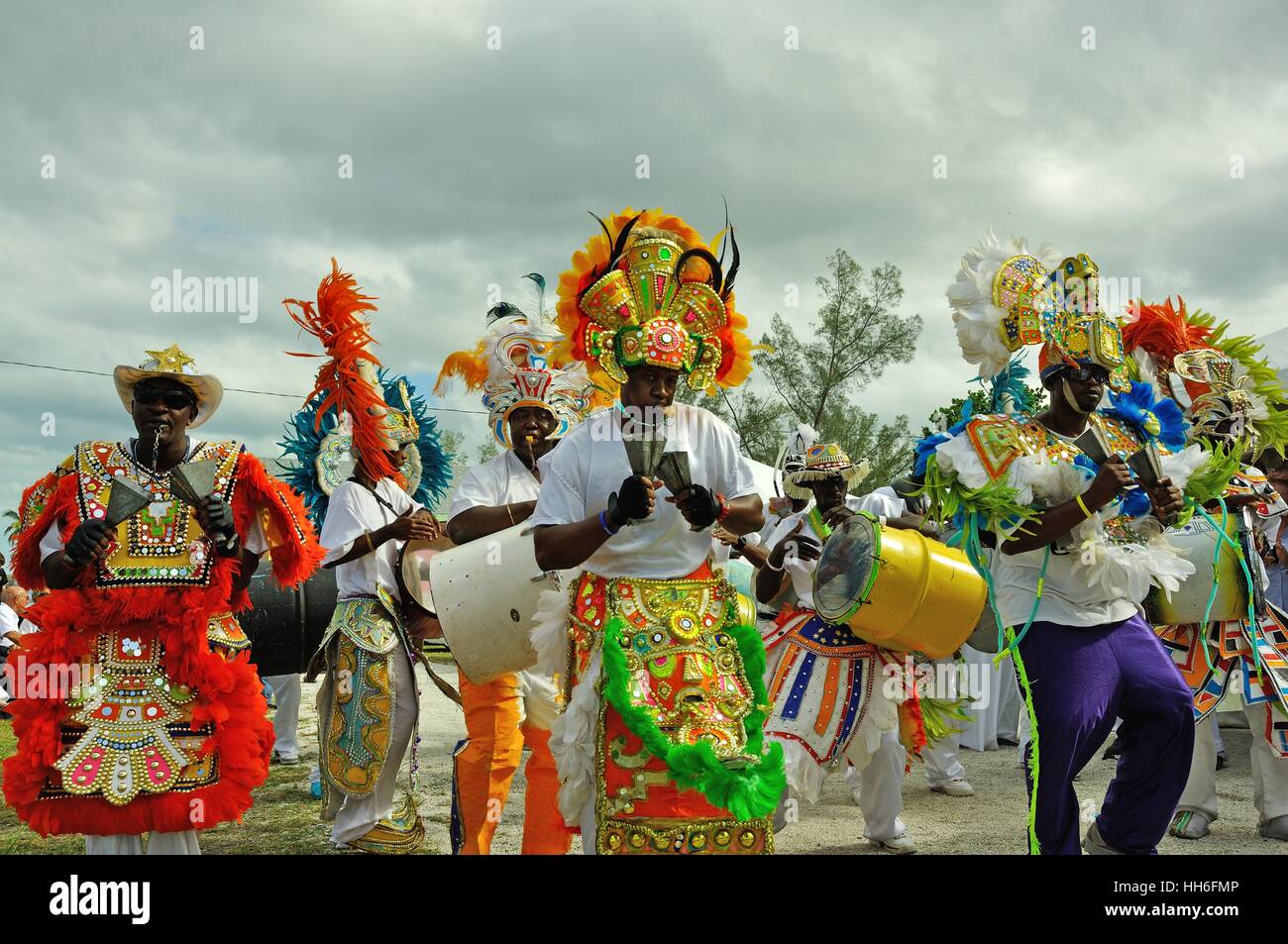 musicians in carnival dress in a Junkanoo band playing in a street parade on Nassau Bahamas Stock Photo