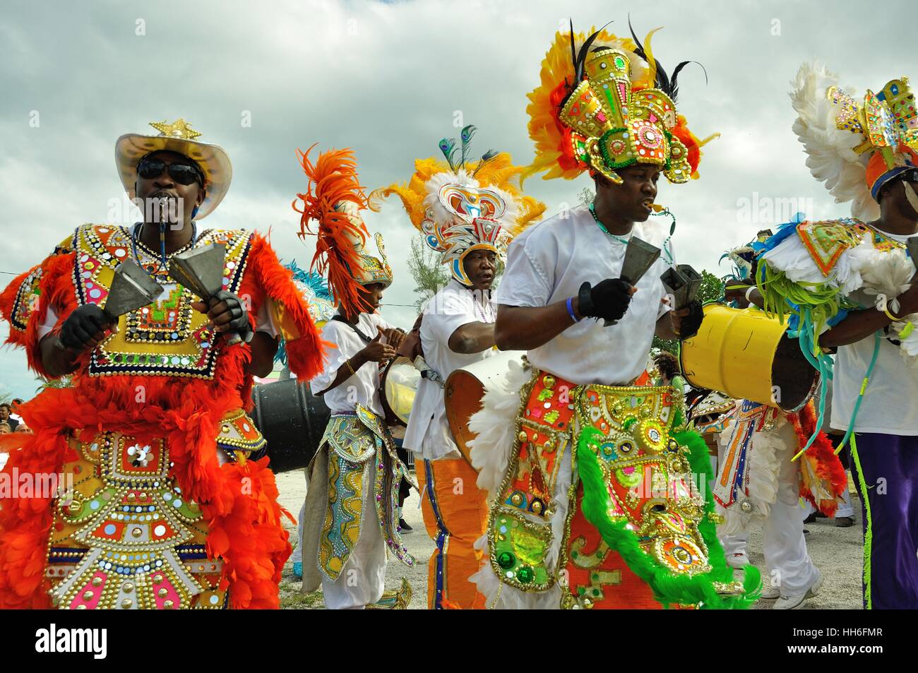 musicians in carnival dress in a Junkanoo band playing in a street parade on Nassau Bahamas Stock Photo