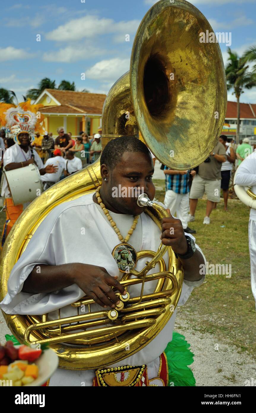 Sousaphone player in carnival dress in a Junkanoo band playing in a street parade on Nassau Bahamas Stock Photo