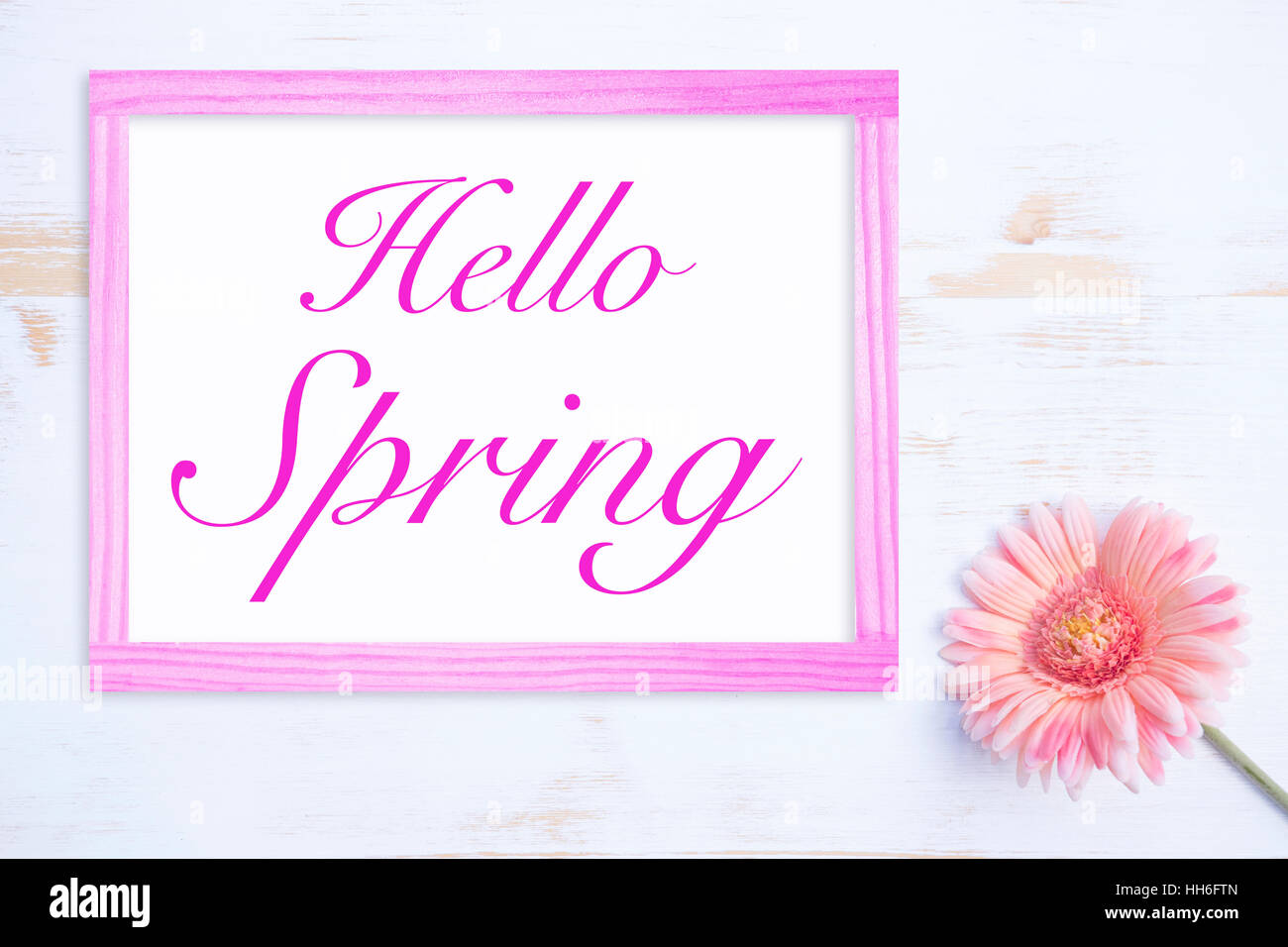 pink flower and wooden frame with words Hello Spring Stock Photo - Alamy