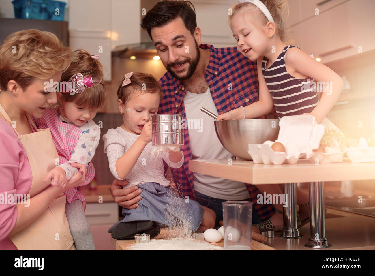 Happy family spending time in the kitchen Stock Photo